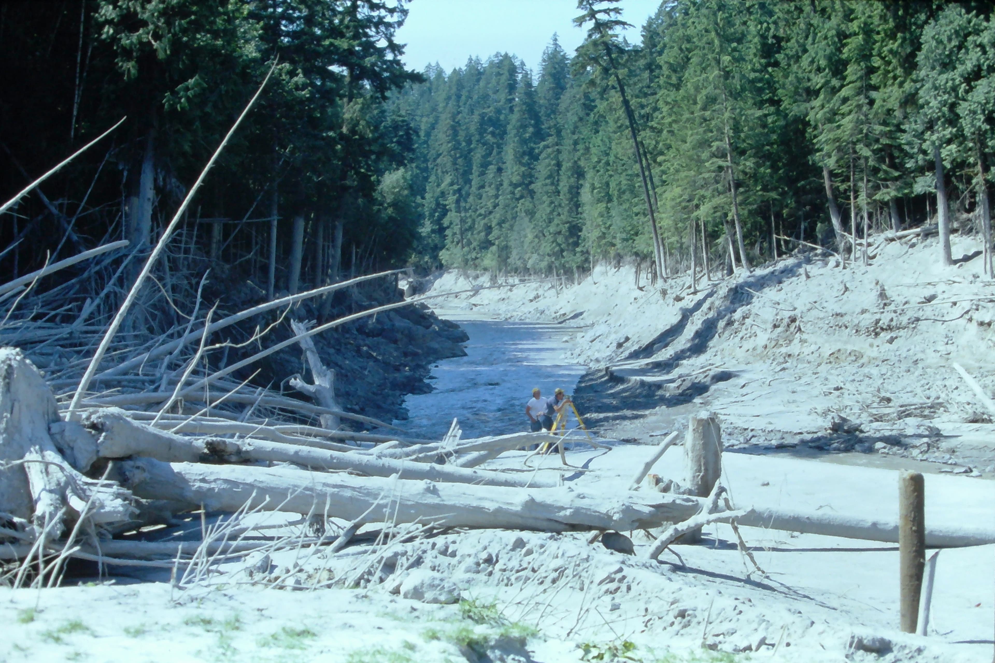July 1980 Ron Lombard and Maury Miles surveying a cross section on the South Fork Toutle River near Four Corners. USGS K. Tanner